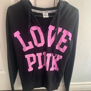 Pink brand pullover with hoodie. Size Small. Black and purple